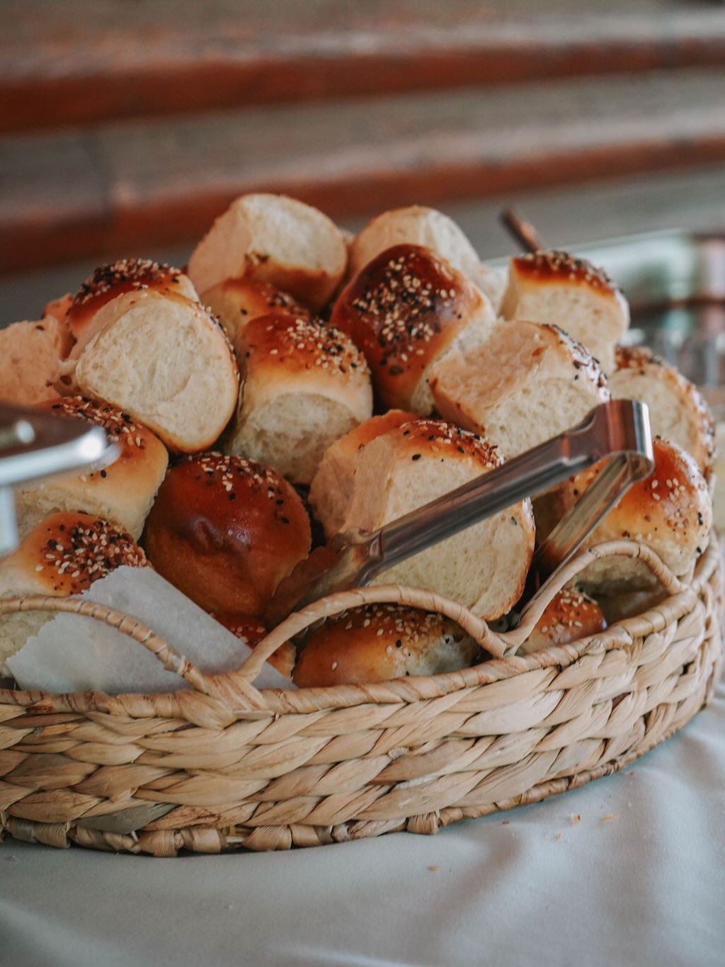 Basket of freshly baked seeded rolls straight from the oven